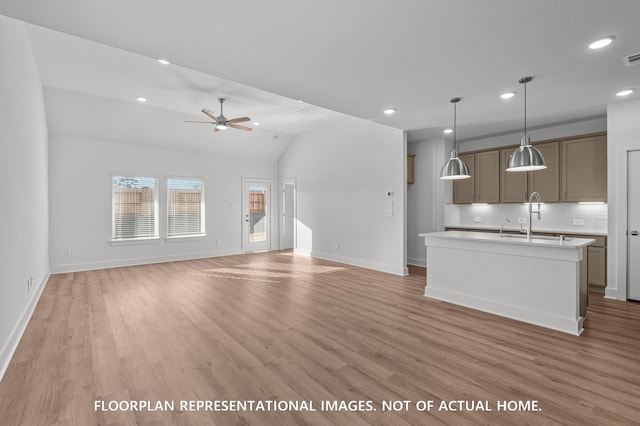 5042 Celestial Ct, La Marque, TX 77563 - unfurnished living room with light wood-style flooring, a ceiling fan, recessed lighting, baseboards, and a sink