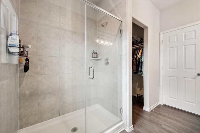 25388 Leather Leaf Ct, Montgomery, TX 77316 - full bath featuring a walk in closet, wood finished floors, and a stall shower