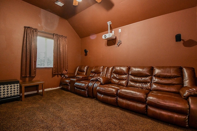 carpeted cinema with vaulted ceiling, a ceiling fan, and visible vents