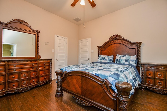 bedroom with visible vents, wood finished floors, and a ceiling fan