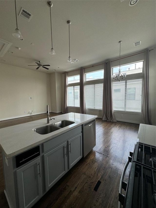 kitchen featuring a sink, dark wood-type flooring, visible vents, dishwasher, and black range with gas cooktop