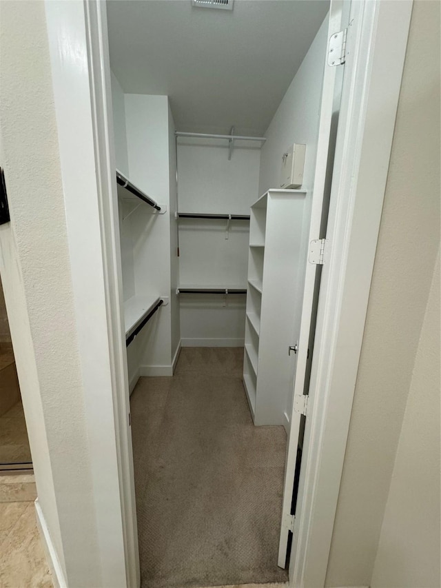 spacious closet featuring light carpet and visible vents