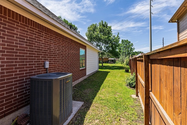 19231 Kelly Pines Ct, Humble, TX 77346 - view of yard featuring central air condition unit and fence