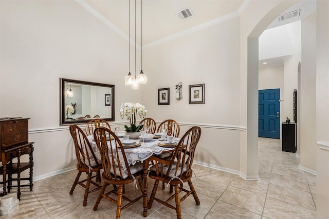 19231 Kelly Pines Ct, Humble, TX 77346 - dining area with crown molding, visible vents, arched walkways, and high vaulted ceiling