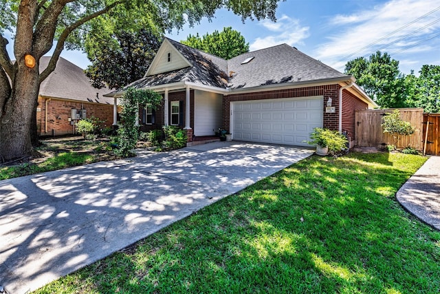 19231 Kelly Pines Ct, Humble, TX 77346 - view of front of property featuring a garage, fence, concrete driveway, a front yard, and brick siding