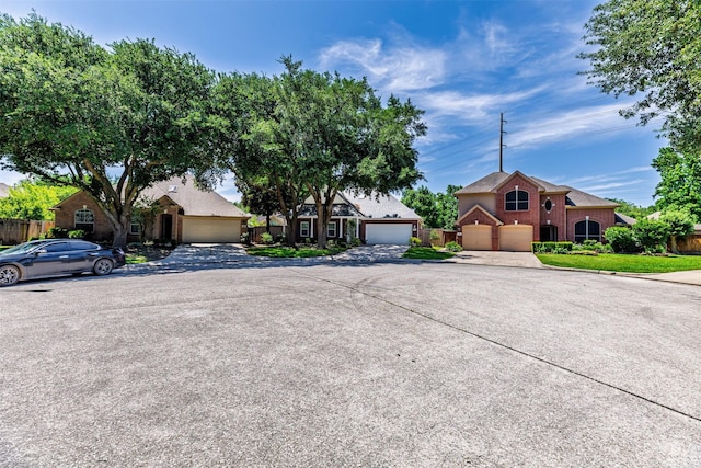 19231 Kelly Pines Ct, Humble, TX 77346 - view of front of property featuring fence, a garage, and brick siding