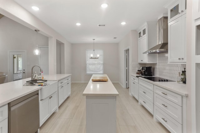 19503 Fisher Dr, Tomball, TX 77377 - kitchen featuring dishwasher, visible vents, a kitchen island, wall chimney range hood, and tasteful backsplash