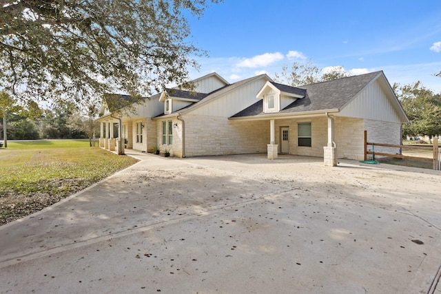 19503 Fisher Dr, Tomball, TX 77377 - view of front facade with stone siding and a front yard