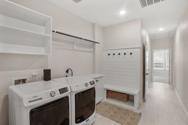 19503 Fisher Dr, Tomball, TX 77377 - laundry area with independent washer and dryer, laundry area, light tile patterned flooring, attic access, and visible vents