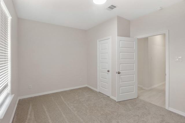 19503 Fisher Dr, Tomball, TX 77377 - unfurnished bedroom with carpet, visible vents, baseboards, and a closet