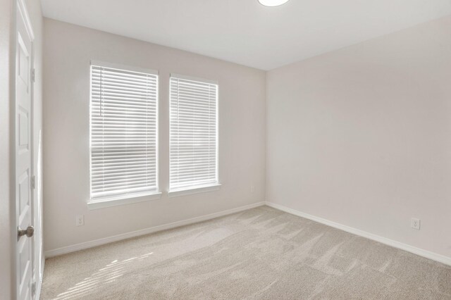 19503 Fisher Dr, Tomball, TX 77377 - carpeted spare room featuring baseboards