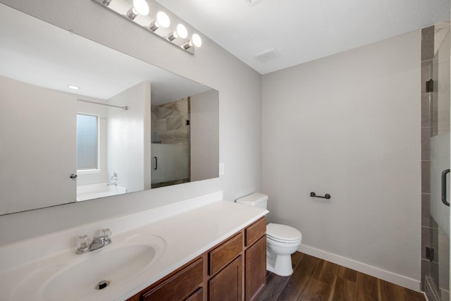 15319 Sableton Crest Ln, Cypress, TX 77429 - full bath with toilet, wood finished floors, baseboards, a shower stall, and vanity