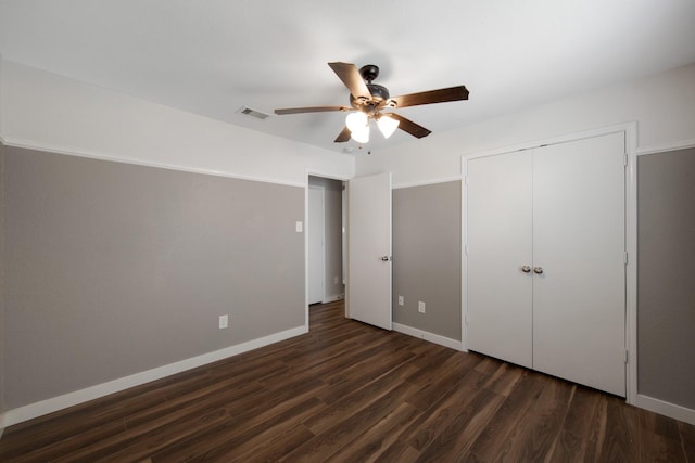 15319 Sableton Crest Ln, Cypress, TX 77429 - unfurnished bedroom with a closet, dark wood finished floors, visible vents, baseboards, and ceiling fan
