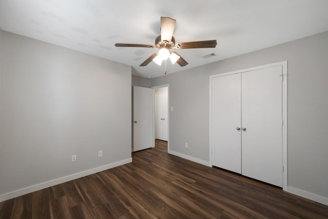 15319 Sableton Crest Ln, Cypress, TX 77429 - unfurnished bedroom featuring a closet, visible vents, dark wood-style flooring, baseboards, and ceiling fan