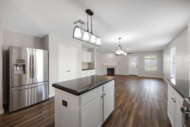15319 Sableton Crest Ln, Cypress, TX 77429 - kitchen with dark countertops, stainless steel fridge, and dark wood-style floors
