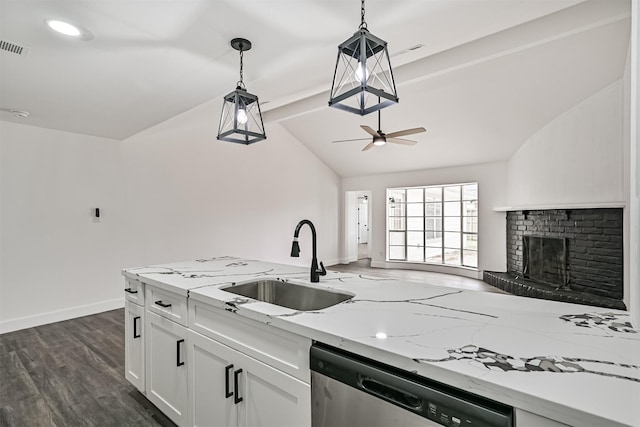 512 Stoneledge Dr, Friendswood, TX 77546 - kitchen with a sink, dishwasher, white cabinets, ceiling fan, and hanging light fixtures