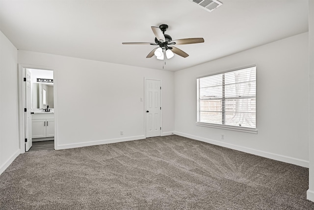 512 Stoneledge Dr, Friendswood, TX 77546 - empty room with carpet floors, a ceiling fan, baseboards, and a sink