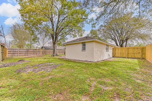 view of yard with a fenced backyard