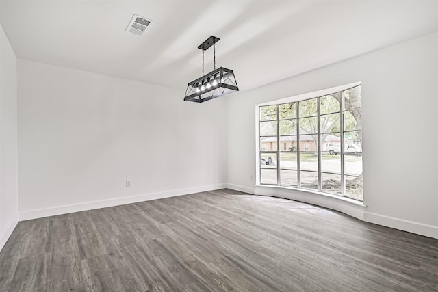 512 Stoneledge Dr, Friendswood, TX 77546 - unfurnished dining area featuring dark wood-style flooring and baseboards