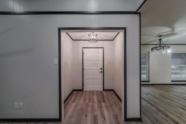 213 Westview Dr, Sealy, TX 77474 - entryway featuring a notable chandelier, baseboards, and wood finished floors