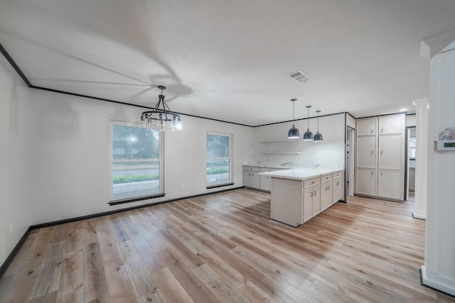 213 Westview Dr, Sealy, TX 77474 - kitchen with baseboards, light countertops, visible vents, and light wood-type flooring