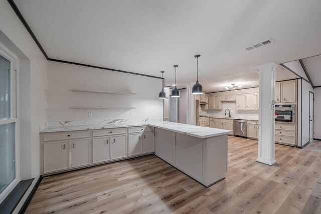 213 Westview Dr, Sealy, TX 77474 - kitchen featuring a peninsula, open shelves, visible vents, light wood finished floors, and appliances with stainless steel finishes