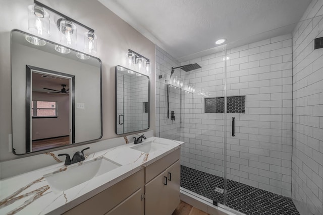 213 Westview Dr, Sealy, TX 77474 - full bath featuring a shower stall, double vanity, and a sink