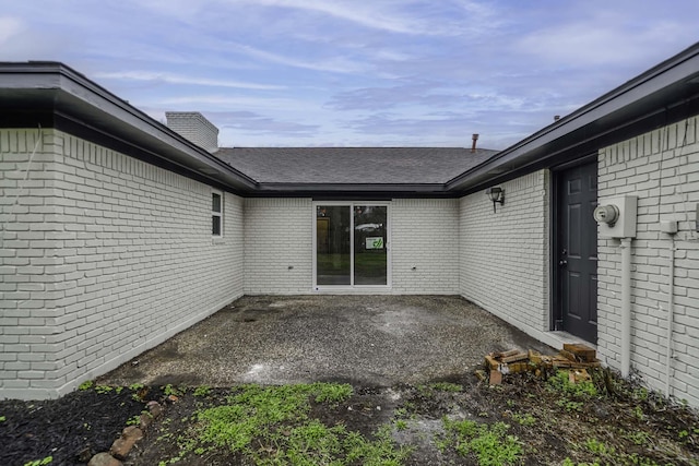 213 Westview Dr, Sealy, TX 77474 - doorway to property with a patio and brick siding