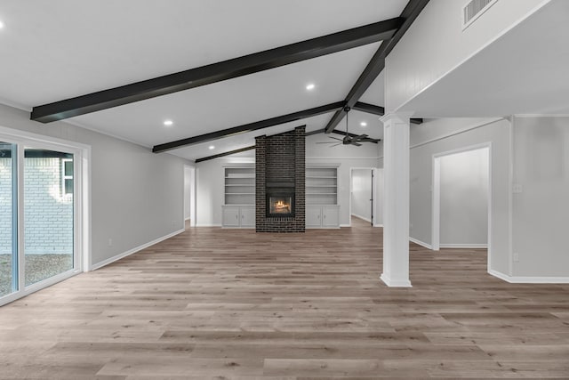 213 Westview Dr, Sealy, TX 77474 - unfurnished living room featuring healthy amount of natural light, ceiling fan, decorative columns, light wood finished floors, and recessed lighting