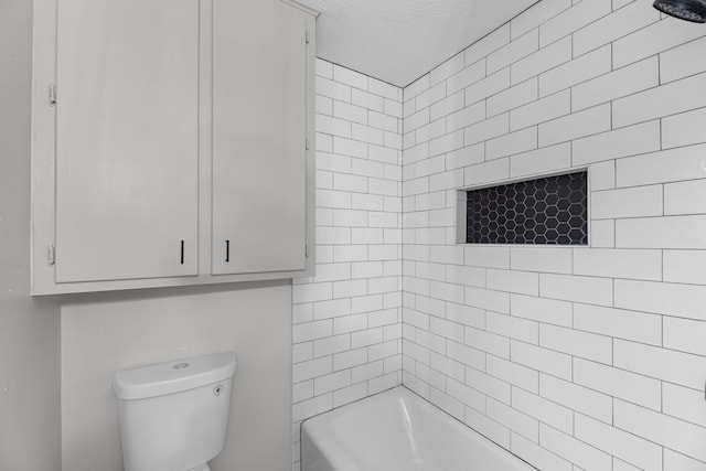 213 Westview Dr, Sealy, TX 77474 - bathroom featuring a tub to relax in and a textured ceiling