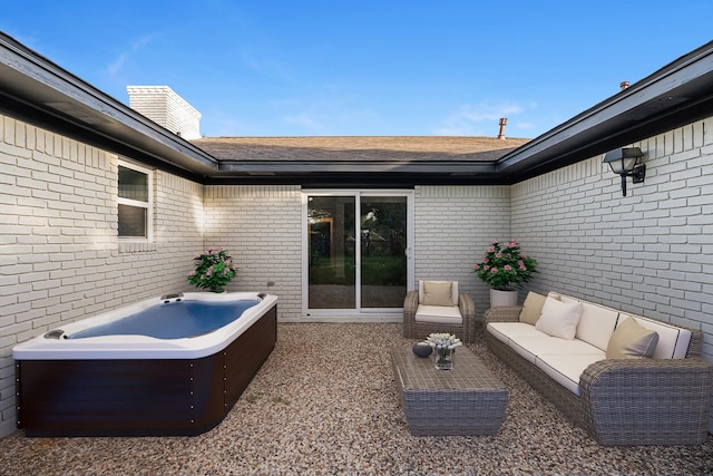 213 Westview Dr, Sealy, TX 77474 - view of patio with a jacuzzi and outdoor lounge area