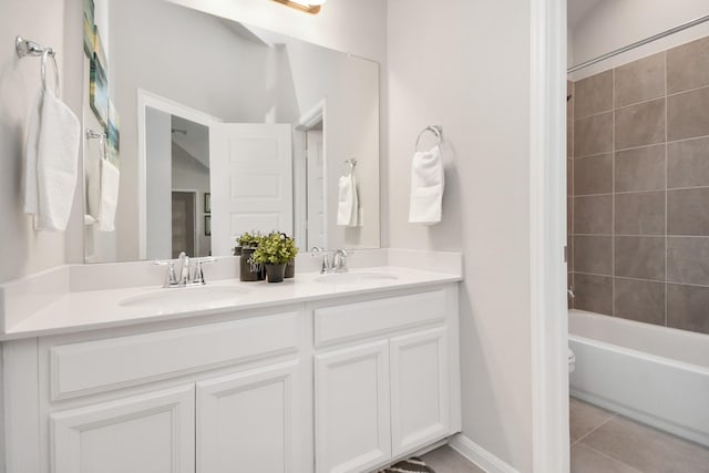 bathroom featuring a sink, double vanity, bathing tub / shower combination, and tile patterned floors