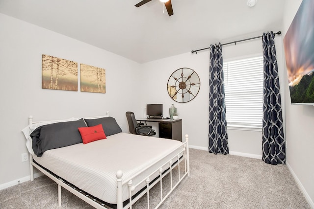carpeted bedroom with baseboards and ceiling fan