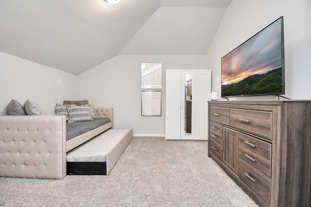 sitting room featuring vaulted ceiling, carpet flooring, and baseboards