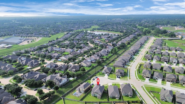 bird's eye view with a water view and a residential view