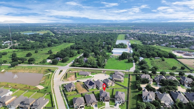drone / aerial view with a water view and a residential view