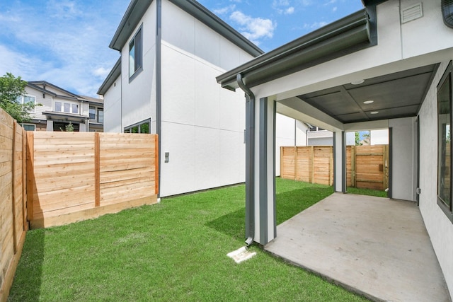 view of yard featuring a patio and a fenced backyard
