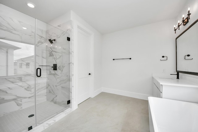 full bath featuring vanity, a marble finish shower, recessed lighting, baseboards, and a freestanding tub