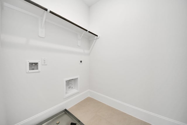 clothes washing area featuring electric dryer hookup, laundry area, hookup for a washing machine, hookup for a gas dryer, and baseboards