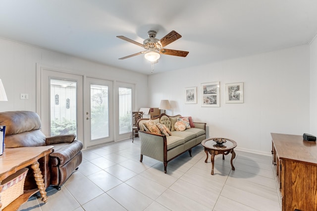 living room featuring light tile patterned floors and ceiling fan