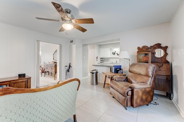 bedroom with a ceiling fan, baseboards, light tile patterned floors, and visible vents