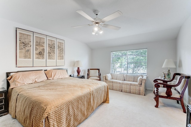 bedroom with light colored carpet, lofted ceiling, and ceiling fan