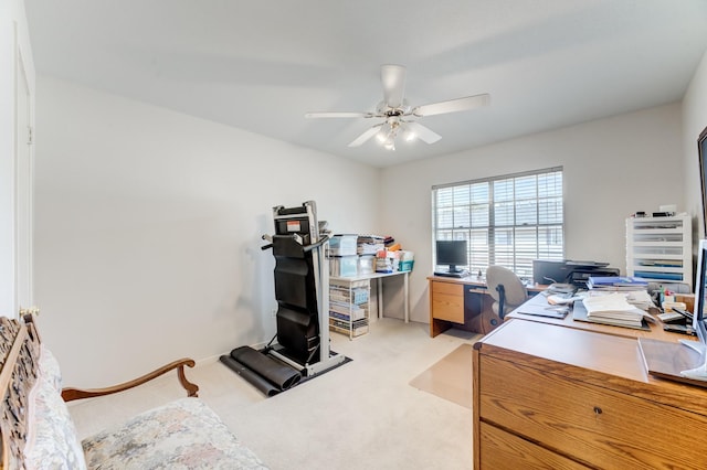 home office featuring ceiling fan and light carpet