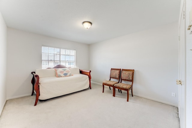 carpeted bedroom featuring baseboards