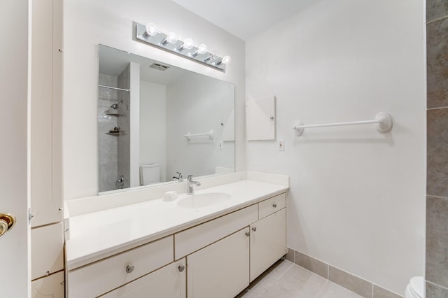 full bathroom with toilet, baseboards, tile patterned floors, vanity, and a shower