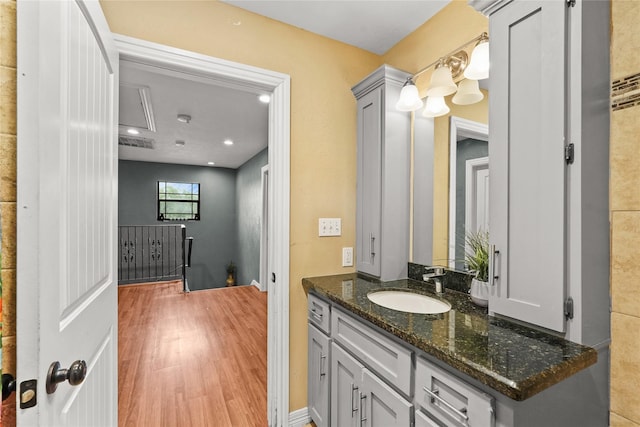 1316 Norham St, Houston, TX 77022 - bathroom featuring wood finished floors, vanity, and recessed lighting