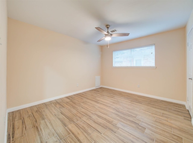 unfurnished room with light wood-type flooring, visible vents, baseboards, and ceiling fan