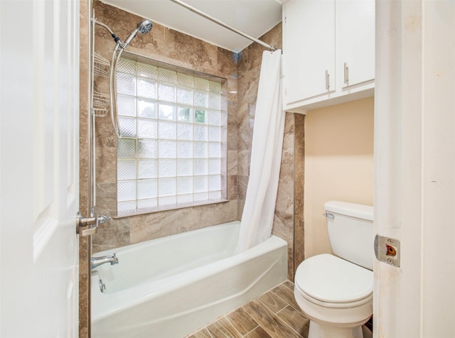 full bathroom with toilet, shower / tub combo, and wood finished floors