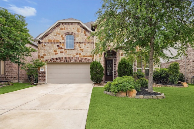 french provincial home featuring brick siding, a front yard, an attached garage, concrete driveway, and stone siding