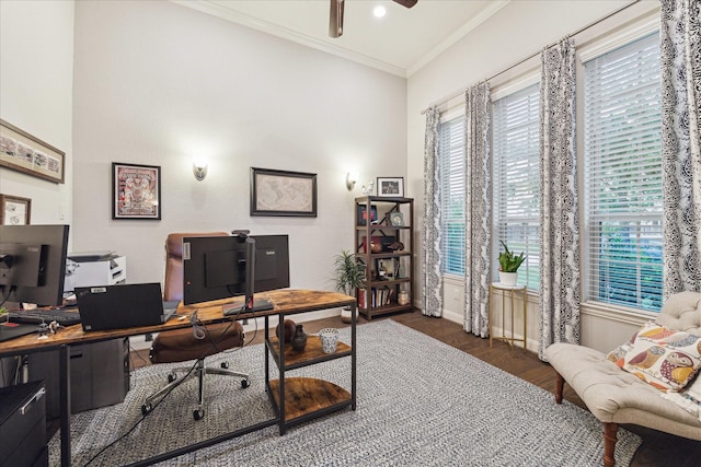 office area featuring ceiling fan, a healthy amount of sunlight, wood finished floors, and ornamental molding